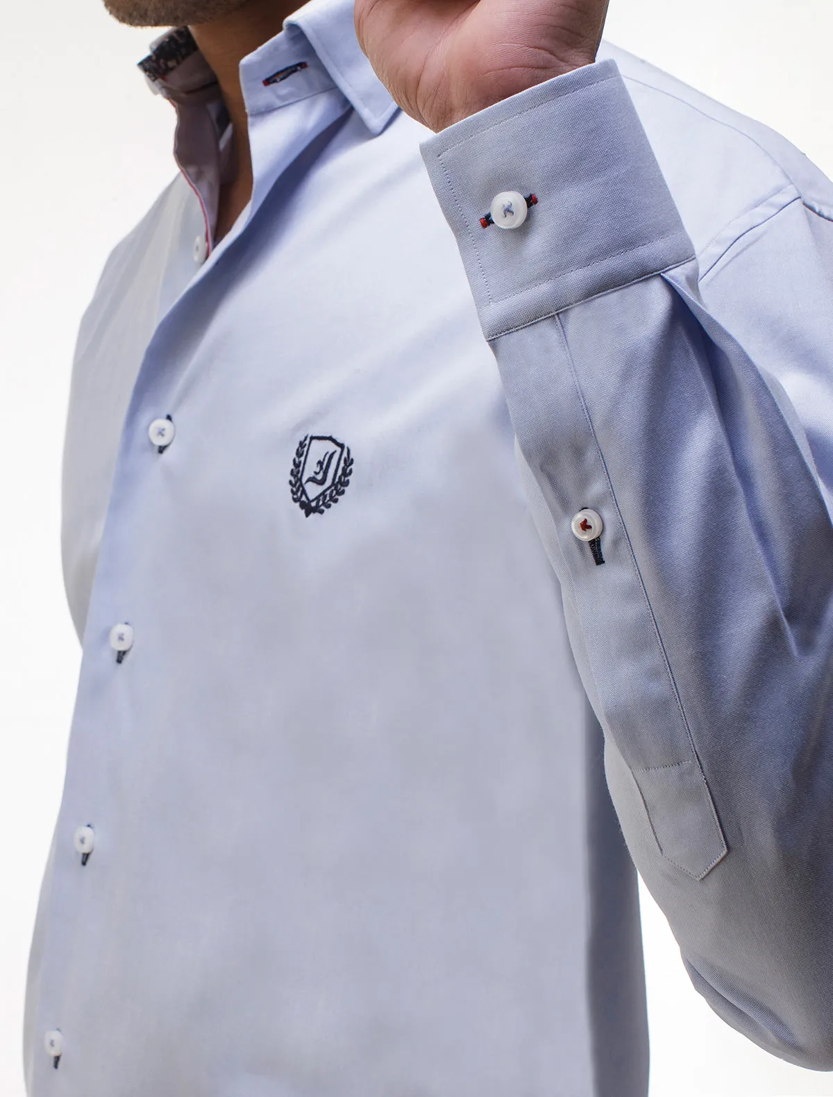 BLUE SHIRT FEATURING EMBROIDERED LOGO